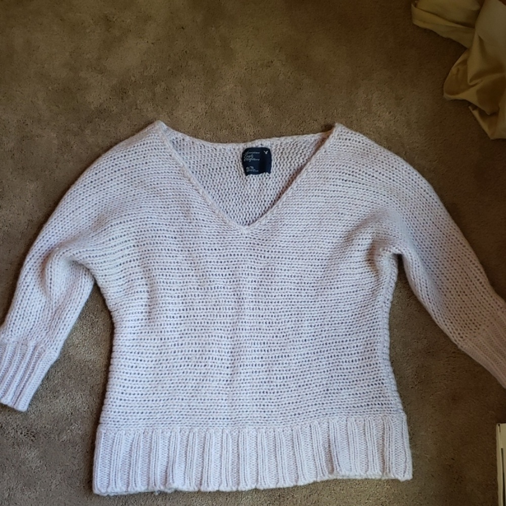 A pink sweater